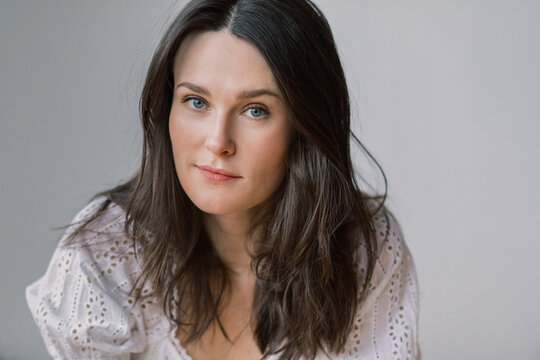 Portrait of a Woman in ruffled white shirt