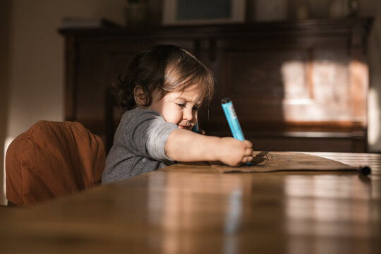 Focused Toddler Drawing with Markers