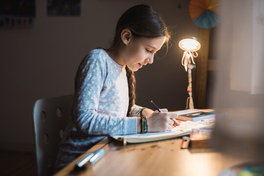 Child Creating Art in a Cozy Bedroom Setting