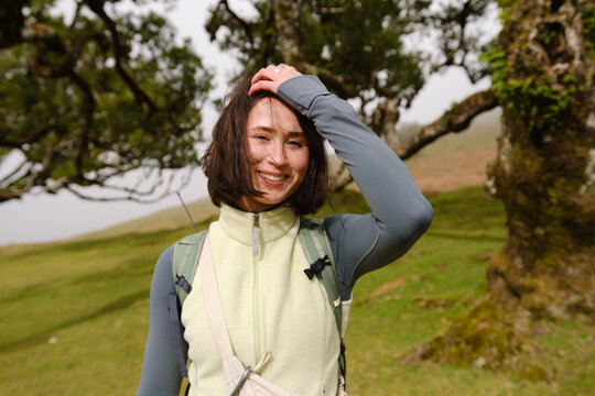 Happy exited Girl in forest. Portugal nature in fanal forest.