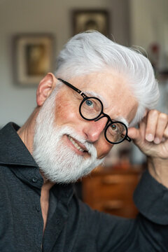Senior Man Smiling With Round Glasses
