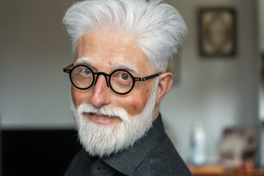 Senior Man With Glasses Smiling At Camera