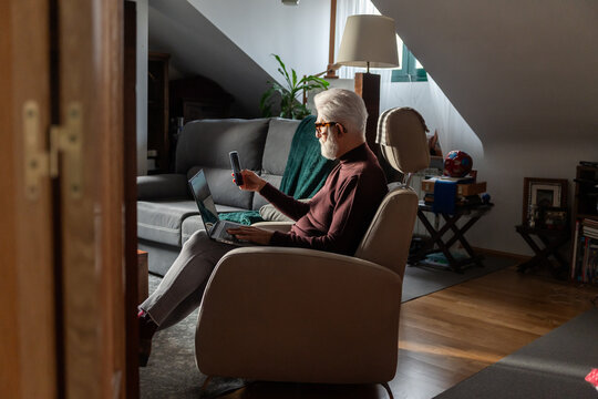 Senior Man Working Remotely at Home