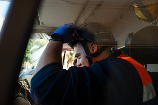 Paramedic wearing protective helmet