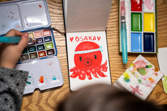 Child painting watercolor Kawaii Octopus, travel Japan