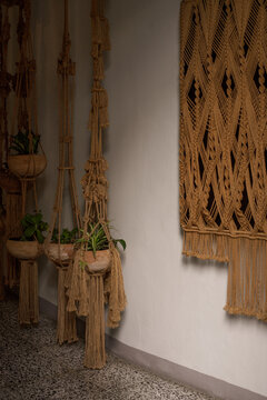 Rustic wall macrame hanging plants with ropes