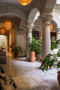 Indoor portico of a patio with stone columns