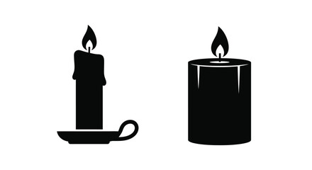 Two black candles with burning flames a striking silhouette © MDJAMAL