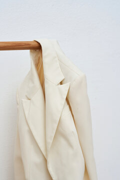 Beige blazer hanging on 
