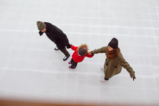 The family is ice skating