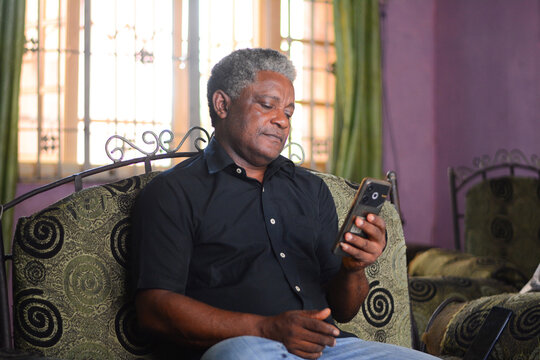 Portrait of man using his mobile phone 