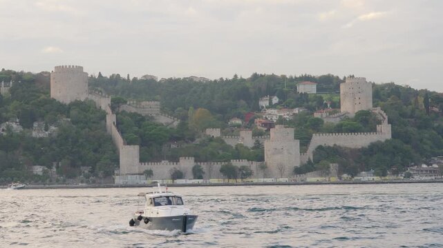 Istanbul Fortress on the Bosphorus With Boat in Front of Historic Castle Walls