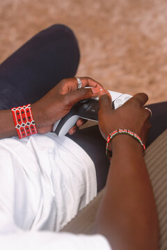 hand on gaming controller