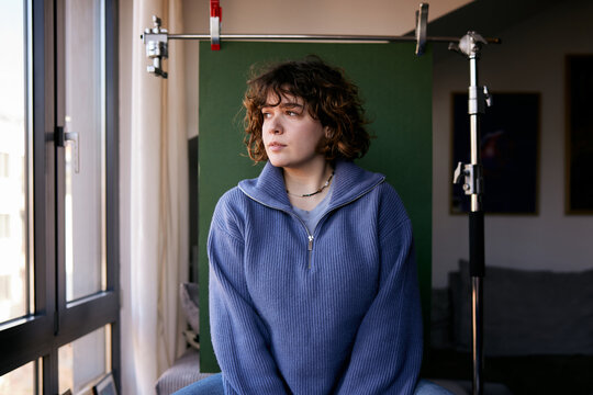 Woman being photographed in a studio