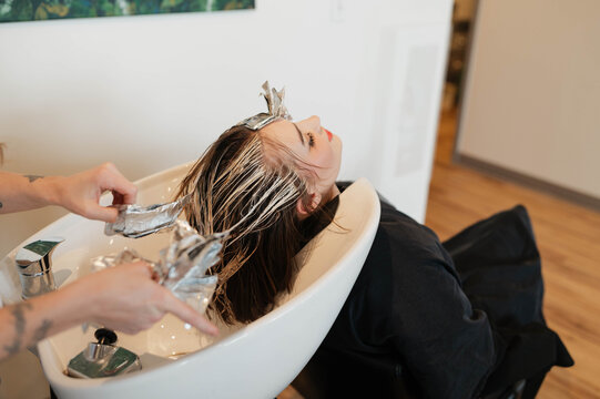A woman having her hair done