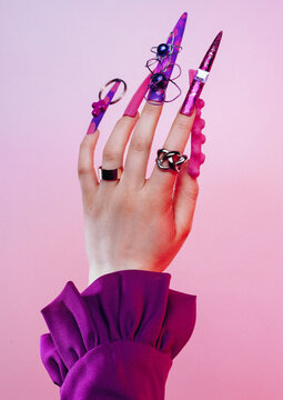 Woman's hand with very long colourful art nails manicure