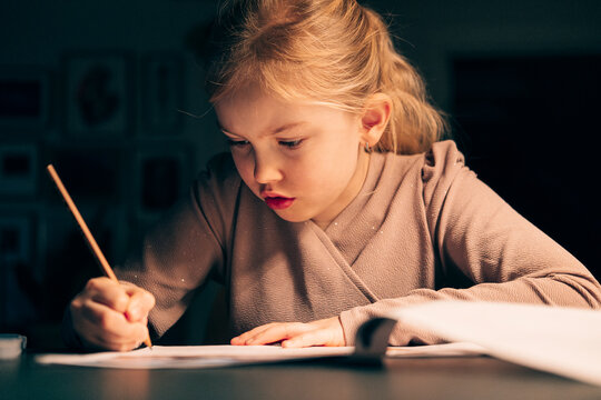 Young girl writing