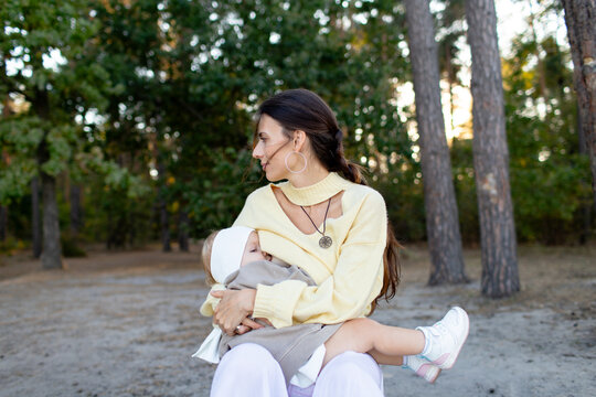 mother is breastfeeding the child