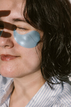 Close-Up of Woman Wearing Under-Eye Patches in Sunlight