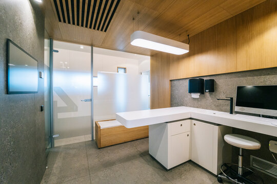 Modern veterinary clinic interior with examination table and computer
