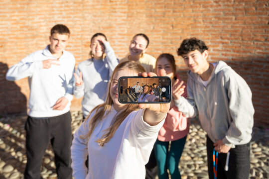 Group photo of students in front of high school building