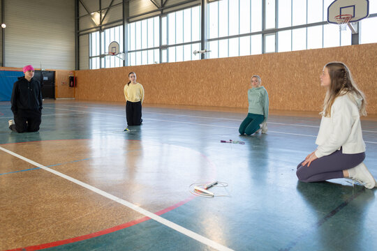 Teenager Gym Class Group Relaxing Break Time