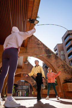 Young street athletes performing near historic arches 