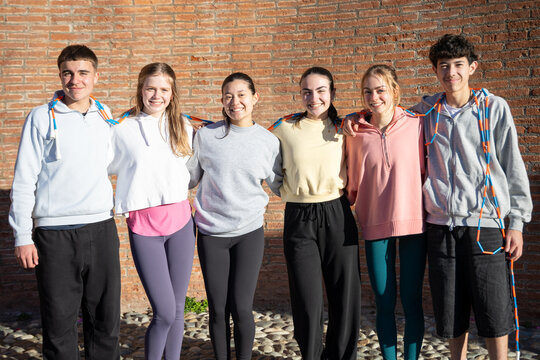 Group photo of students in front of high school building