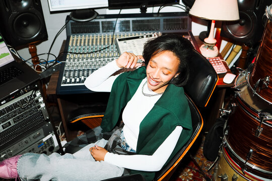 Joyful Woman Artist in Recording Space