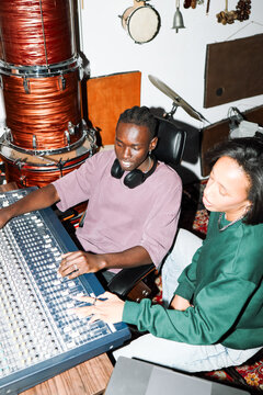 Music Producers Mixing Tracks in Studio
