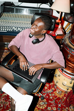 Happy Music Producer Editing Tracks