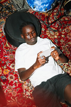 Casual portrait man using phone with flash