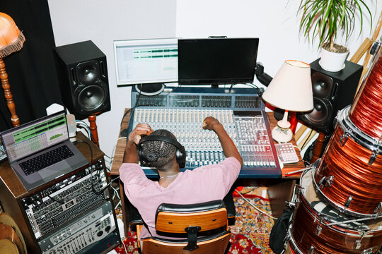Man Working on Music Production Console  in Studio