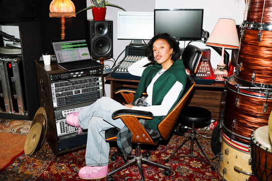 Woman Producer Posing in Music Production Room