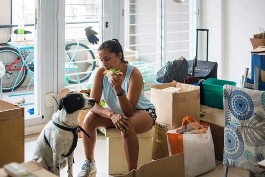 Indigenous Woman taking break to eat pizza 