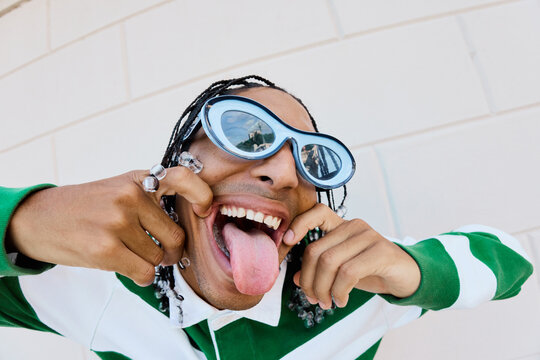 Playful Grimace with Tongue Out and Unique Style