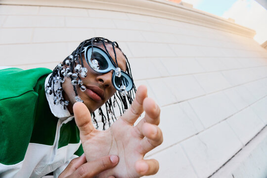 Bold Style Close-Up with Playful Gesture