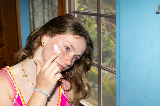 Pretty Teen Skin Care in mirror 