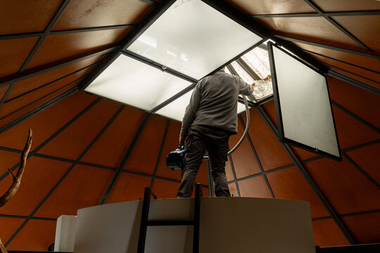 Worker repairing skylight