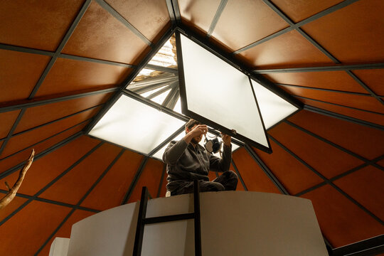 Worker repairing skylight