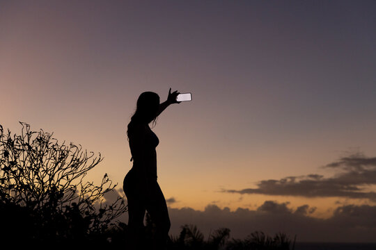 Smile Teen girl mobile phone screen outdoors 