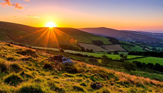 A vibrant sunset over rolling hills. The sun's rays burst forth. Green fields and mountains are bathed in golden light. A serene landscape