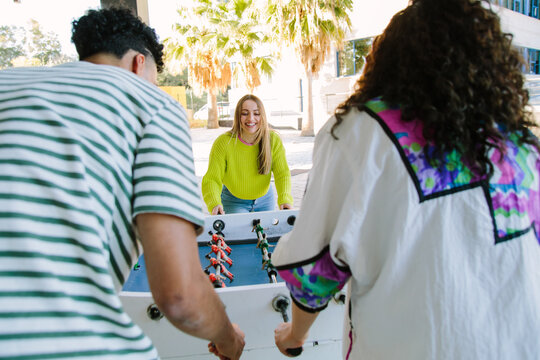 students playing foosball
