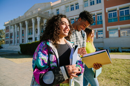 Happy students walking on campus