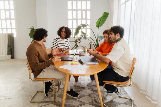 Diverse Teamwork Discussing Together In A Meeting At Modern Office
