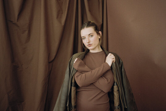 Film photography of stylish woman in earthy fashion tones