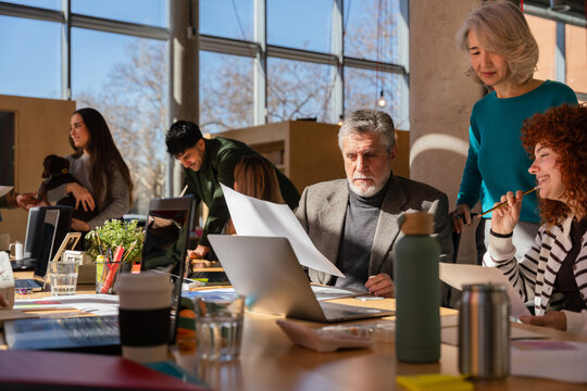 Collaborative meeting in modern office with diverse team