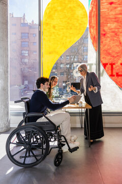 Collaborative office meeting fostering teamwork and inclusivity