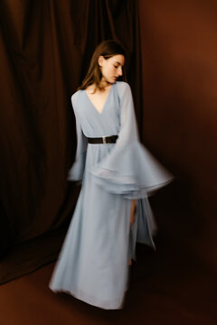 Fashion model wearing elegant dress with blurry efect