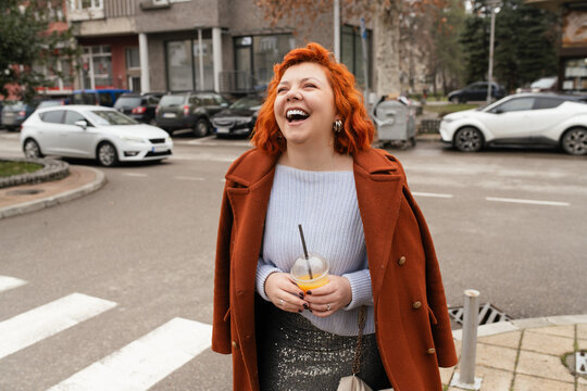 Trendy Redhead Enjoying a Casual Day Out in an Urban Neighborhood